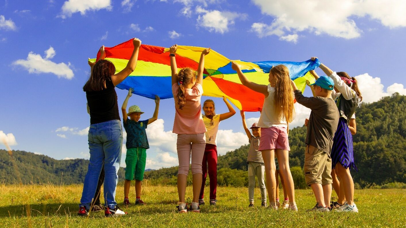 Children playing parachute game