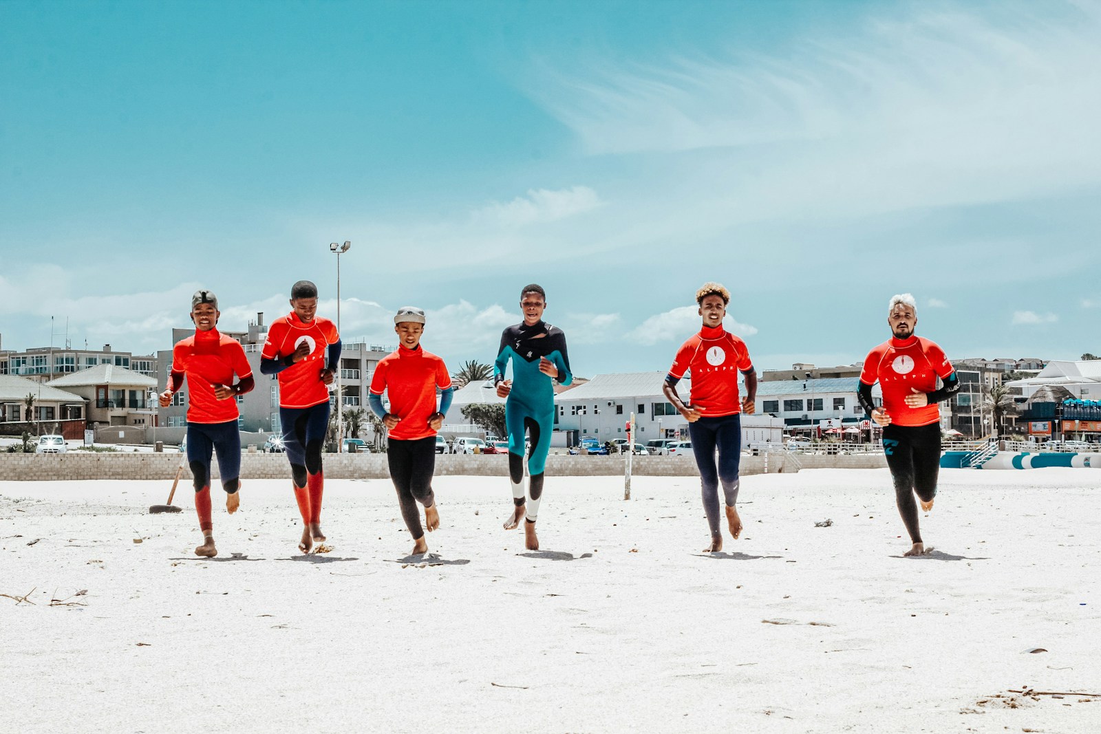 group of people on white sand beach during daytime